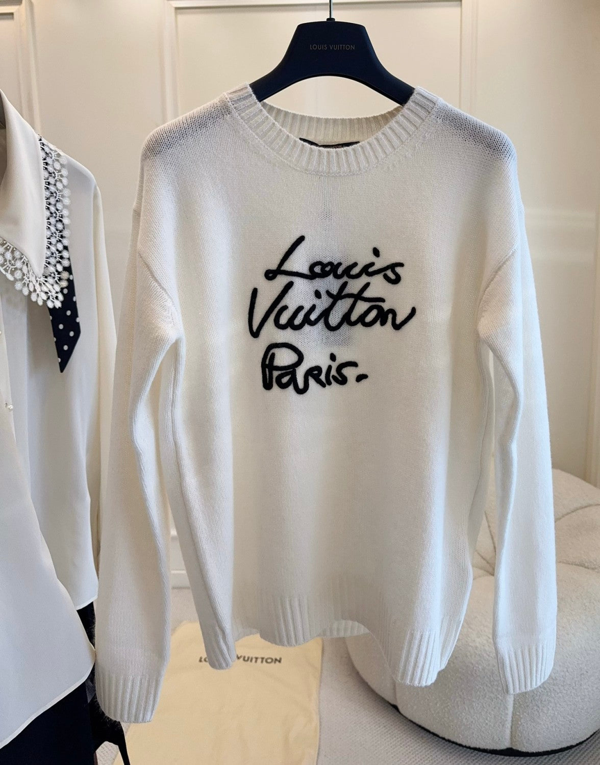 FallWinter 2025 Women's White Sweater. soft and skin-friendly. round neck with black logo embroidery. a casual and comfortable women's sweater. #83197A